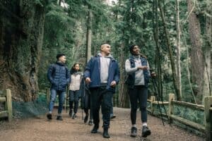 People Hiking in a Forest