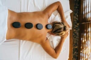 Person with Hot Stones on their Back